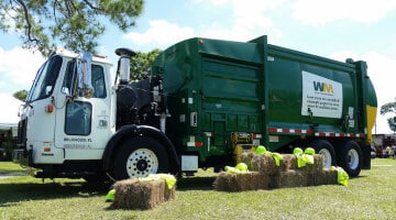 A Waste Management truck parked in a field in Pinellas Park, Florida
