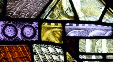 Detail of a post World War II stained glass window in Manchester Cathedral.