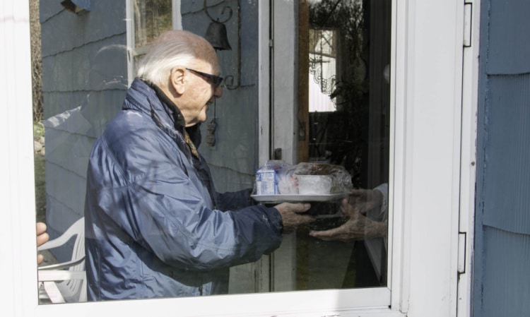 Connecticut State Senator Joe Crisco helped deliver prepared meals to homebound residents of Naugatuck as part of the New Opportunities, Inc. "Meals on Wheels" program.