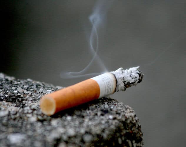 A burning cigarette photographed up close