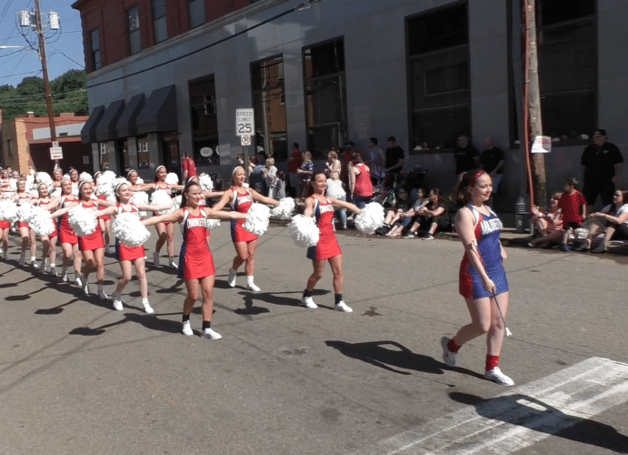 Chartiers Valley cheerleaders march down Station Street as part of the 2017 Bridgeville Memorial Day parade