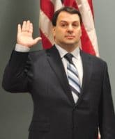 Bridgeville Mayor Pat DeBlasio raises his right hand to be sworn into office.