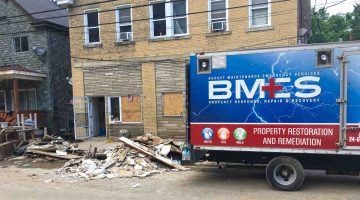 A property restoration truck parked outside a building on Baldwin Street days after the June 2018 flood.