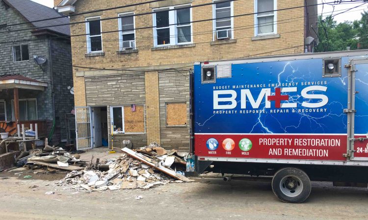 A property restoration truck parked outside a building on Baldwin Street days after the June 2018 flood.