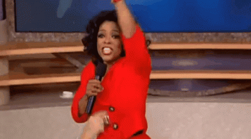 Oprah Winfrey points to her audience in this gif image.