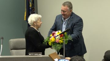 Council president William Henderson presents mayor Betty Copeland with a bouquet of flowers in the night she received the Pennsylvania Mayor of the Year award.